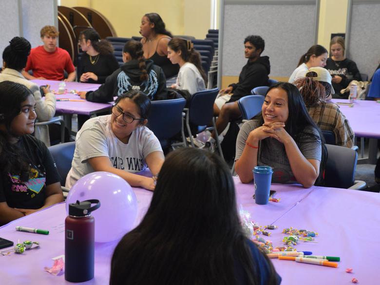 students at sister2sister event sitting at tables